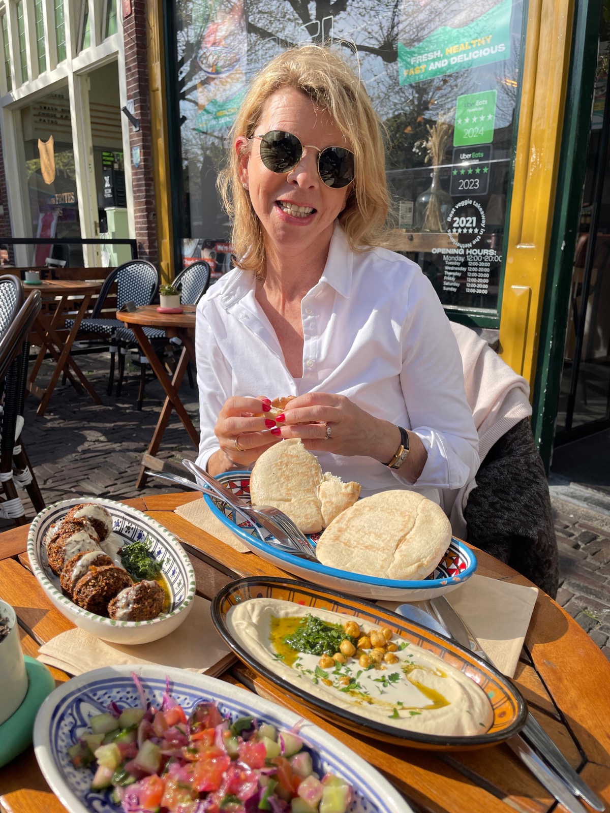 Enjoying falafel and hummus at the Botermarkt