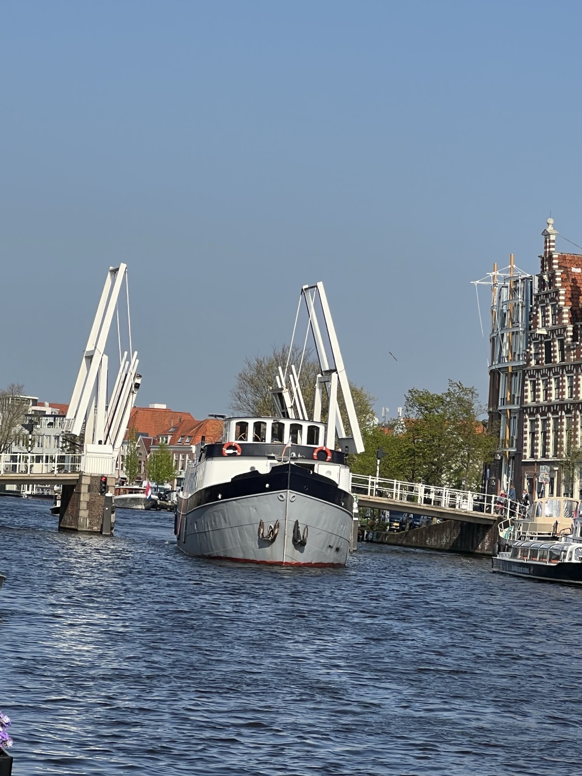 Boat passing through the bridge on the Spaarne river